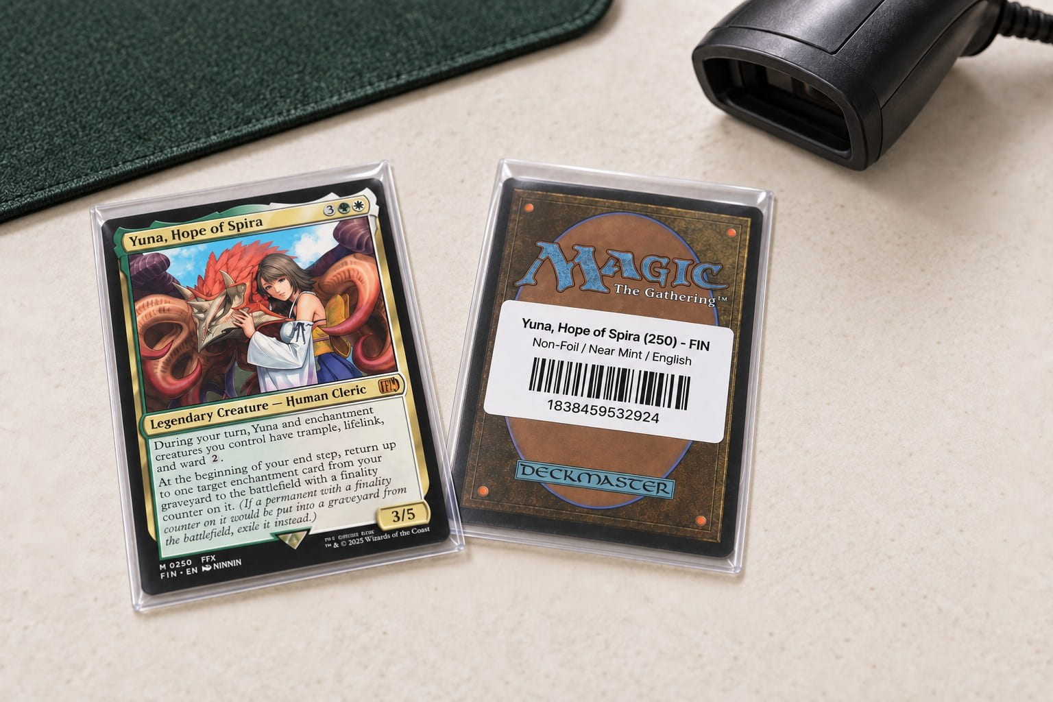 Yuna card face beside a matching Yuna barcode label on the back of a penny sleeve, lying on the counter